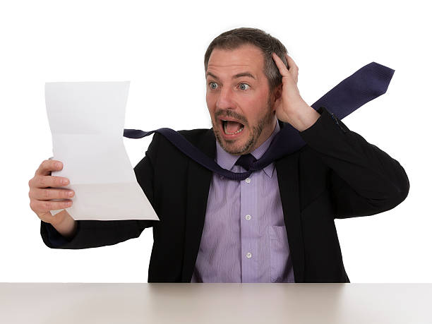 istock Businessman is horrified by a unbelievable bill  V 175898310