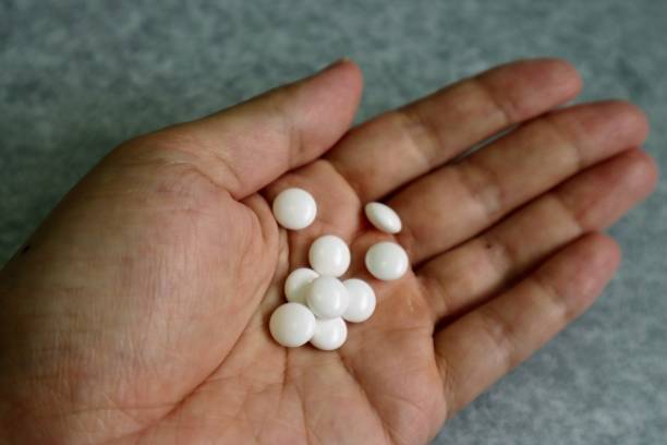 istock Close-up of medicine on hands 1758992196