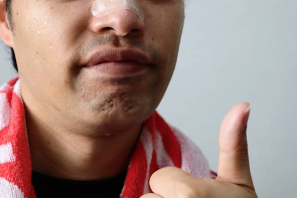 istock A person wearing nasal dilation tape 1758998661