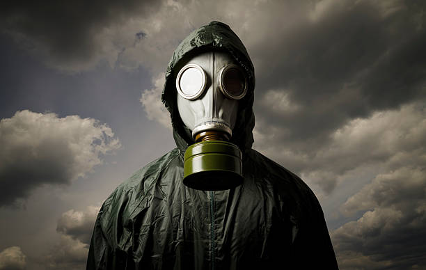 Gas mask Man wearing a gas mask on his face biochemical weapon photos stock pictures, royalty-free photos & images