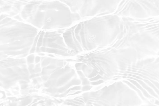istock Defocus blurred transparent white colored clear calm water surface texture with splashes reflection. Trendy abstract nature background. Water waves in sunlight with copy space. Blue watercolor shine. 1759014390