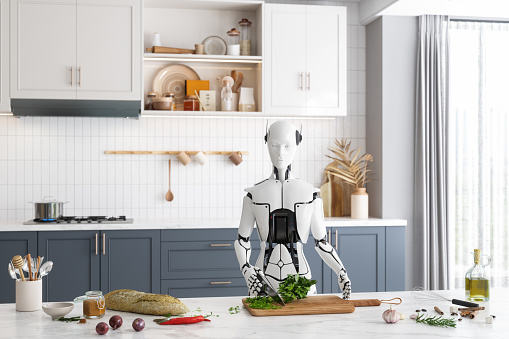 Close-up View Of Robotic Chef Chopping Basil In The Kitchen. Artificial Intelligence And Robotics Concept