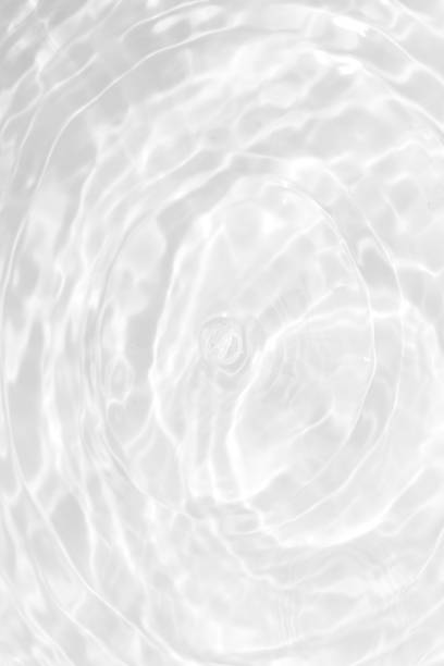 istock Defocus blurred transparent blue colored clear calm water surface texture with splashes reflection. Trendy abstract nature background. Water waves in sunlight with copy space. Blue watercolor shine. 1759015527