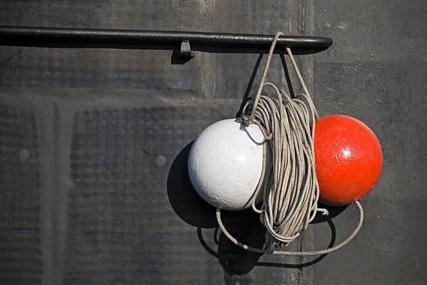 Red and white signal spheres hanging on the rope