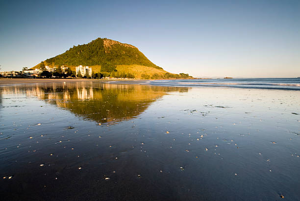 Reflections on Mount Maunganui Beach, New Zealand Reflections on Mount Maunganui Beach, New Zealand mount maunganui stock pictures, royalty-free photos & images