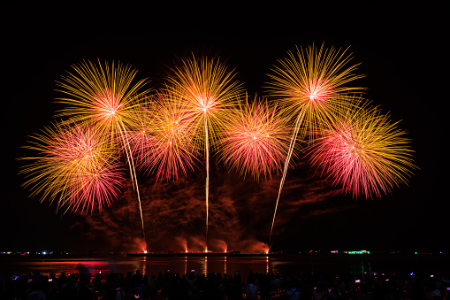 PATTAYA, CHONBURI, THAILAND, Real Fireworks at Pattaya bay, Pattaya national Fireworks Festival contest, November of every Year, Beautiful of bright light fireworks Show in middle sea, for postcard wallpaper background photo, concept