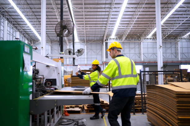 istock Blue collar worker and cardboard package factory. 1759094016