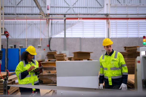 istock Blue collar worker and cardboard package factory. 1759097019