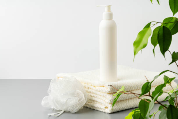 istock White cosmetics container mockup with towels on gray background 1759112854