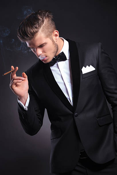 istock business man with smoke in his mouth 175911339