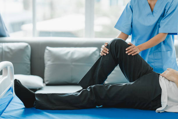 istock osteoarthritis physical therapist Therapy and help patient exercise and treat young athlete's injured knee. Wound rehabilitation, physical therapy, recovery concept 1759117583