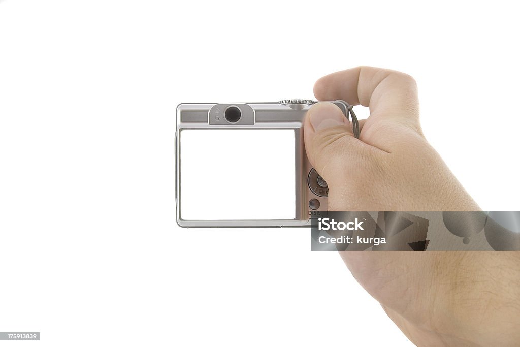 The digital camera in a hand isolated over white background Adult Stock Photo