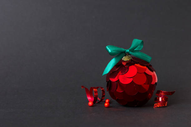 istock Christmas ball on colored background. decoration bauble with ribbon bow with copy space 1759142901