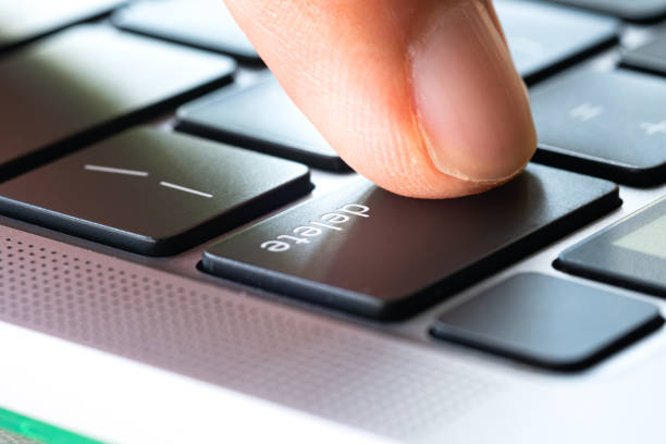 istock Finger of the computer user, he presses the delete button on the computer keyboard 1759165059