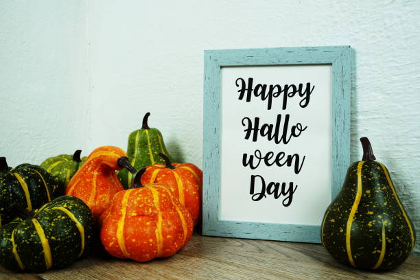istock Happy Halloween Day typography text with pumpkin decoration on wooden table 1759175265