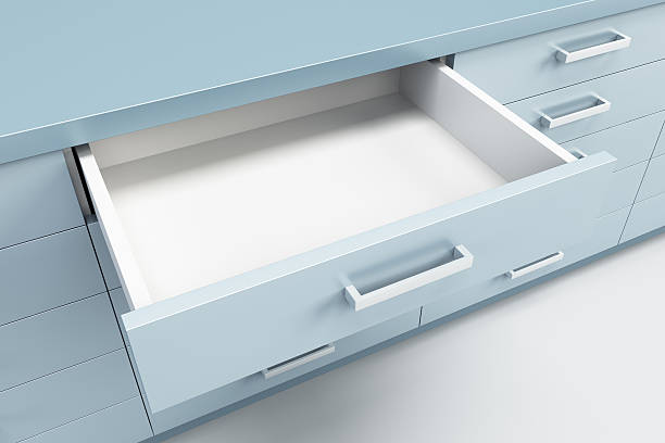 cupboard with opened drawer stock photo