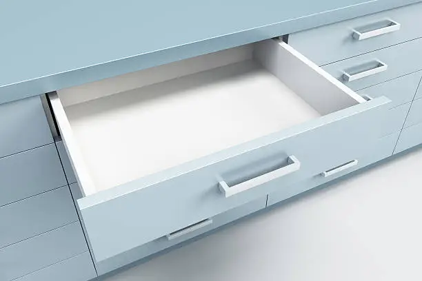 Photo of cupboard with opened drawer