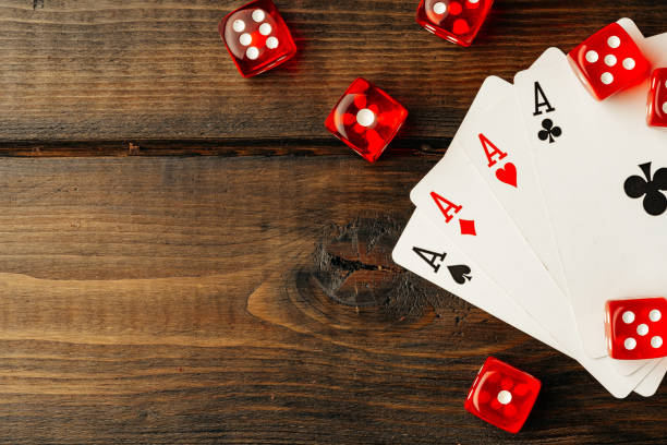 istock Playing cards and dice cubes on wooden background 1759183469