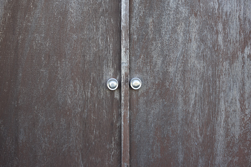 Brass Doorknob on a Blue Door