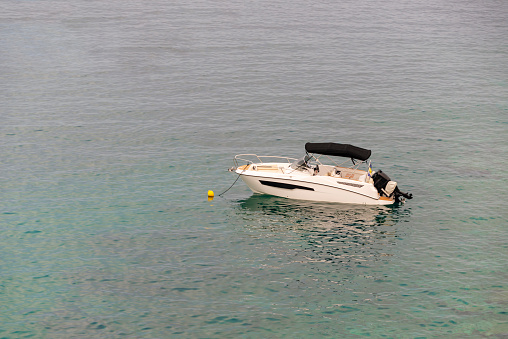 Boat at Toska resort bay near Kavala town. Greece, Europe.