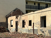 Old house under demolition in the city