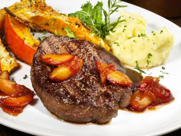 Photo of Deer Steak with smashed Potato, roasted Pumpkin and caramelized Apricots