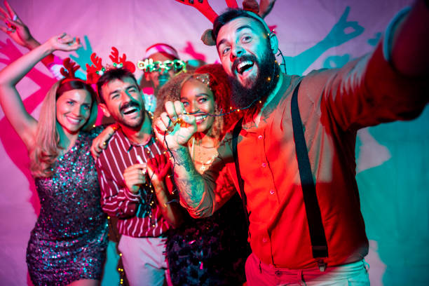 istock Friends having fun taking selfies at New Year party 1759212685