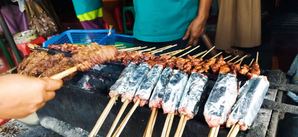 istock Sate Buntel or Satay Buntel is satay made from minced mutton wrapped in mutton fat is being grilled on charcoal 1759215483