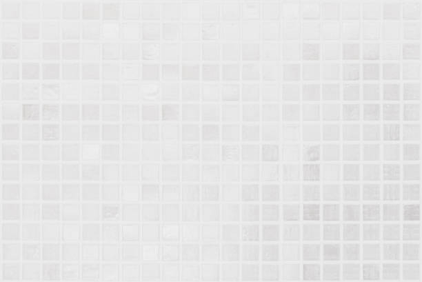 istock White tile wall chequered background bathroom texture. Ceramic brick wall and floor tiles mosaic background in bathroom and kitchen clean. Design pattern geometric with grid wallpaper decoration. 1759216070