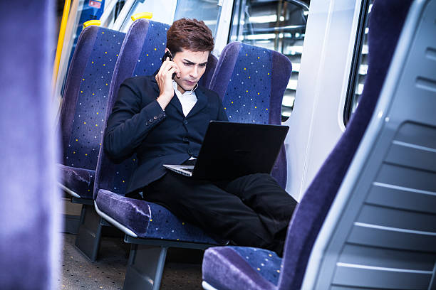 istock Young businessman working in the train. 175922112