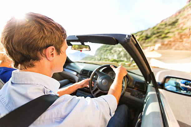 istock Man Driving Convertible Car During Road Trip 175924129