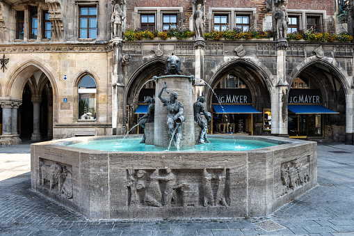 Munich, Germany - Jun 18, 2023: Fish Fountain, Fischbrunnen in front of the New New Town Hall at Marienplatz, the historic center square in Munich, Germany