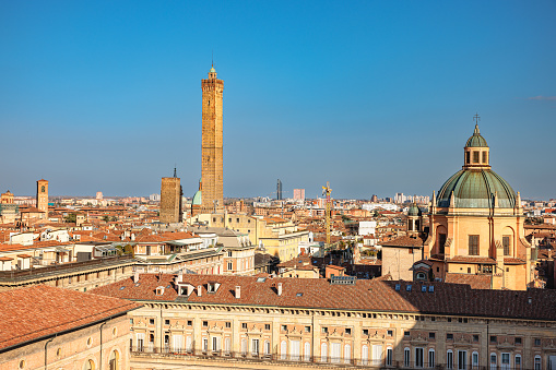 Bologna, Italy - March 5, 2023: View on rooftops of historical buildings in Piazza Maggiore and city skyline on a clear day in the center of Bologna, Italy