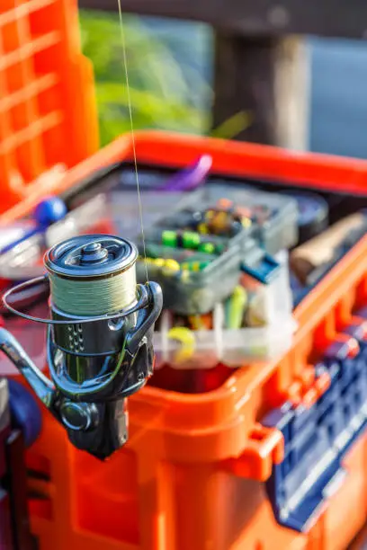 Photo of A large fisherman's tackle box fully stocked with lures and gear for fishing.fishing lures and accessories.Fishing tackle - fishing spinning. Kit of fishing lures.