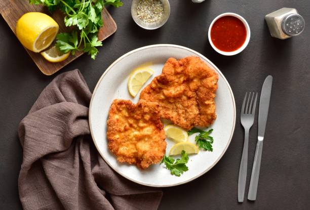 istock Schnitzel with lemon and leaves of parsley 1759401140