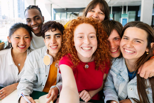 istock Multiracial group of young student people taking selfie while studying together 1759403575
