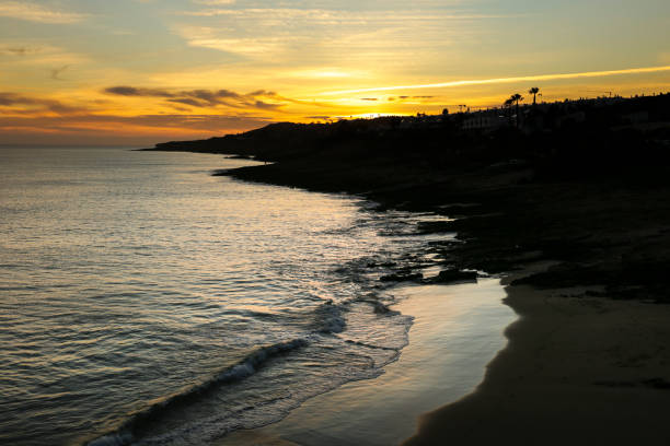 istock Beautiful sunset at Praia da Luz, Algarve 1759423965