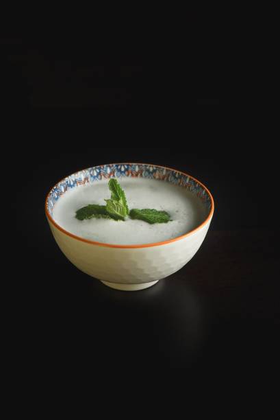 istock a bowl of soup sits on a table with a sprig of mint 1759427963