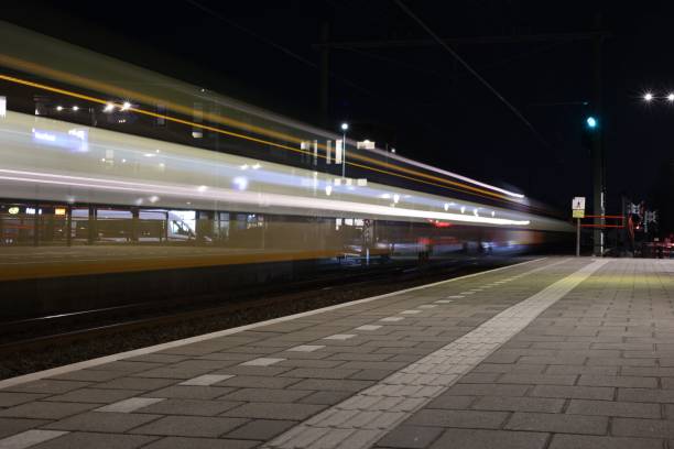 istock a blurry view of an empty train platform by night 1759430712