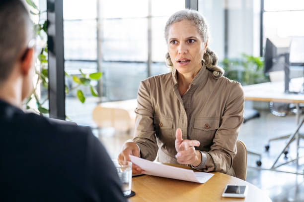 istock Serious HR manager face to face with employee 1759433520