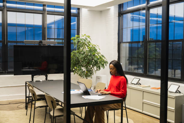 istock Independent professional using laptop in meeting room 1759433542