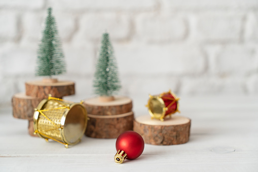 Christmas tree and decor xmas ball on white table and wall background.clean minimal simple style.holiday still life mockup to display design