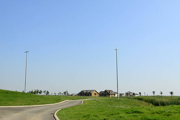 istock road and lamp by the lawn 175944416