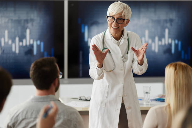 istock Happy senior doctor leading a presentation in board room. 1759444540