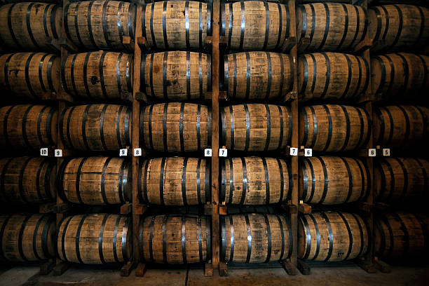 Stack of Wooden Whiskey Barrels Wooden Whiskey Barrels in Lynchburg, Tennessee, USA whiskey stock pictures, royalty-free photos & images