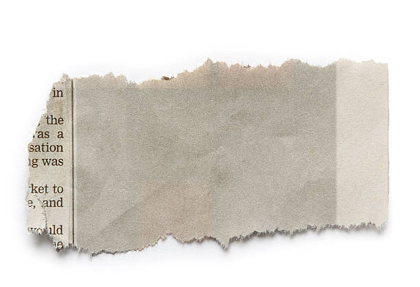 istock Faded scrap of newspaper on white background 175946287