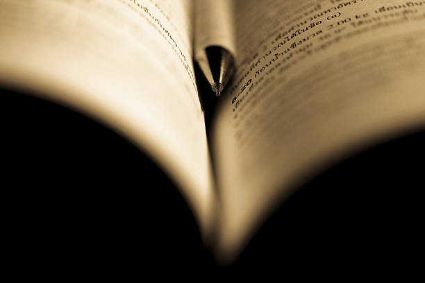 istock antique book with pencil 175947259