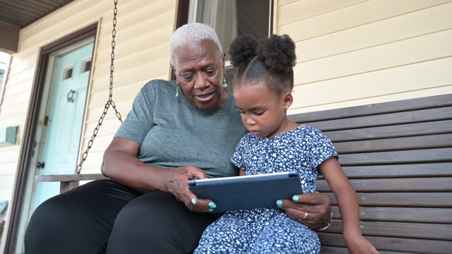 African-American family members using digital tablet