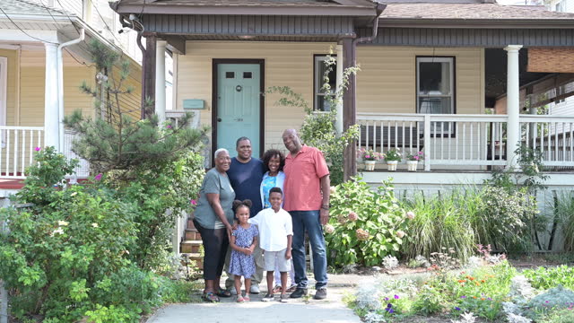 Candid outdoor portrait of African-American family