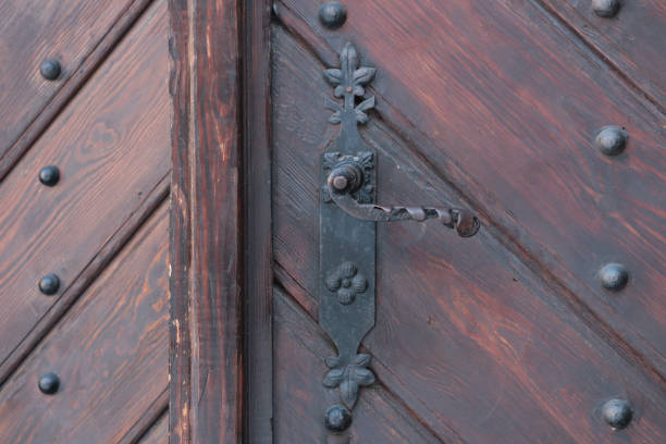 istock Beautiful old door with iron handle. 1759478866